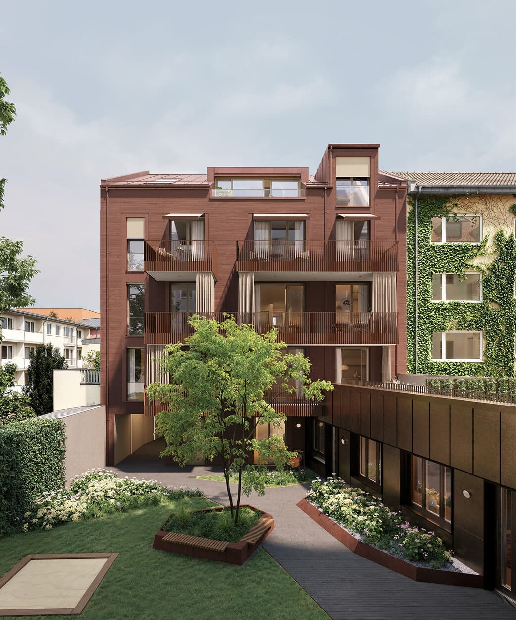 Blick aus dem Stadthaus in den begrünten Innenhof mit Hofhaus und Ateliers