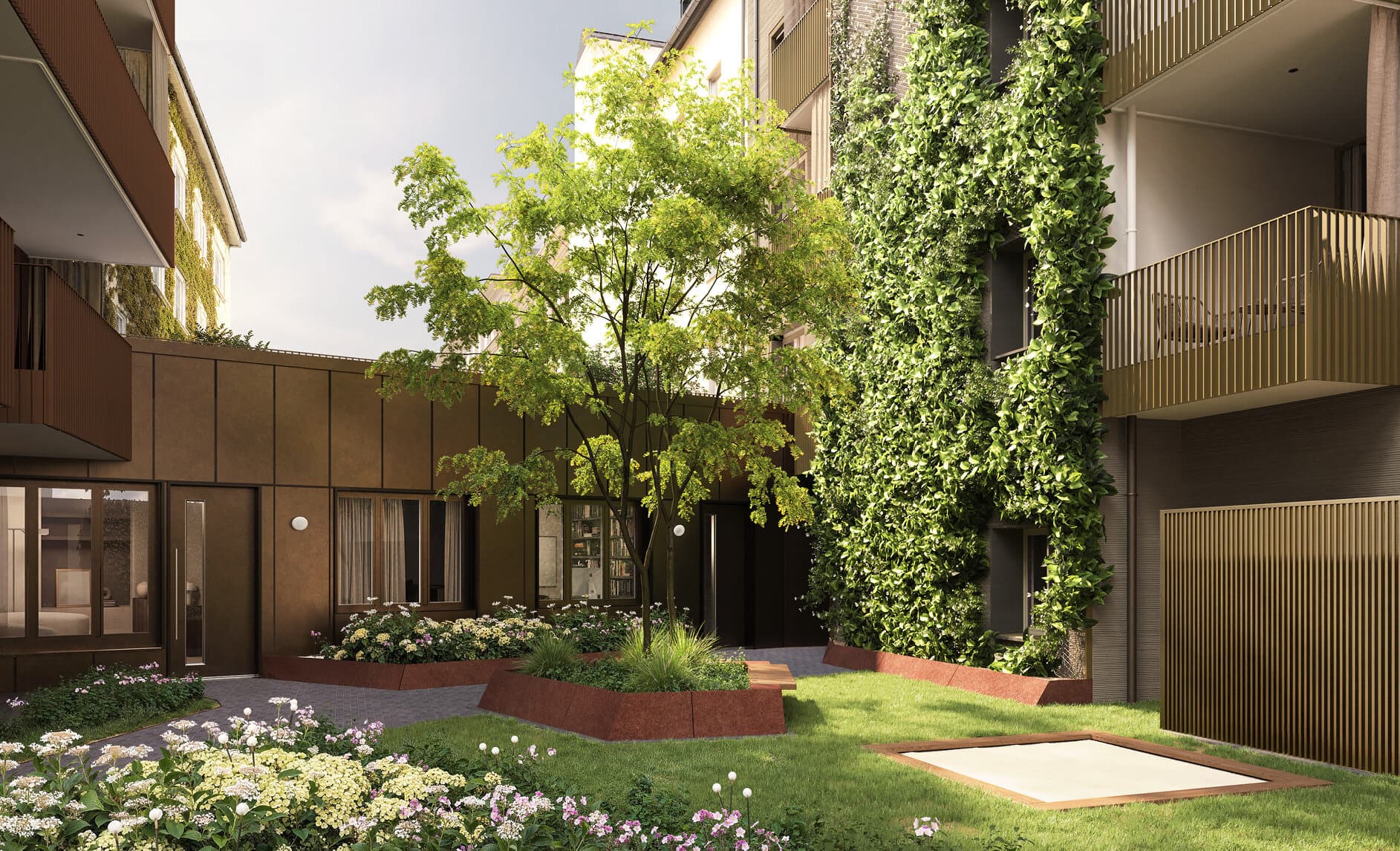 Begrünter Innenhof mit Baum und Efeufassade vor den Ateliers